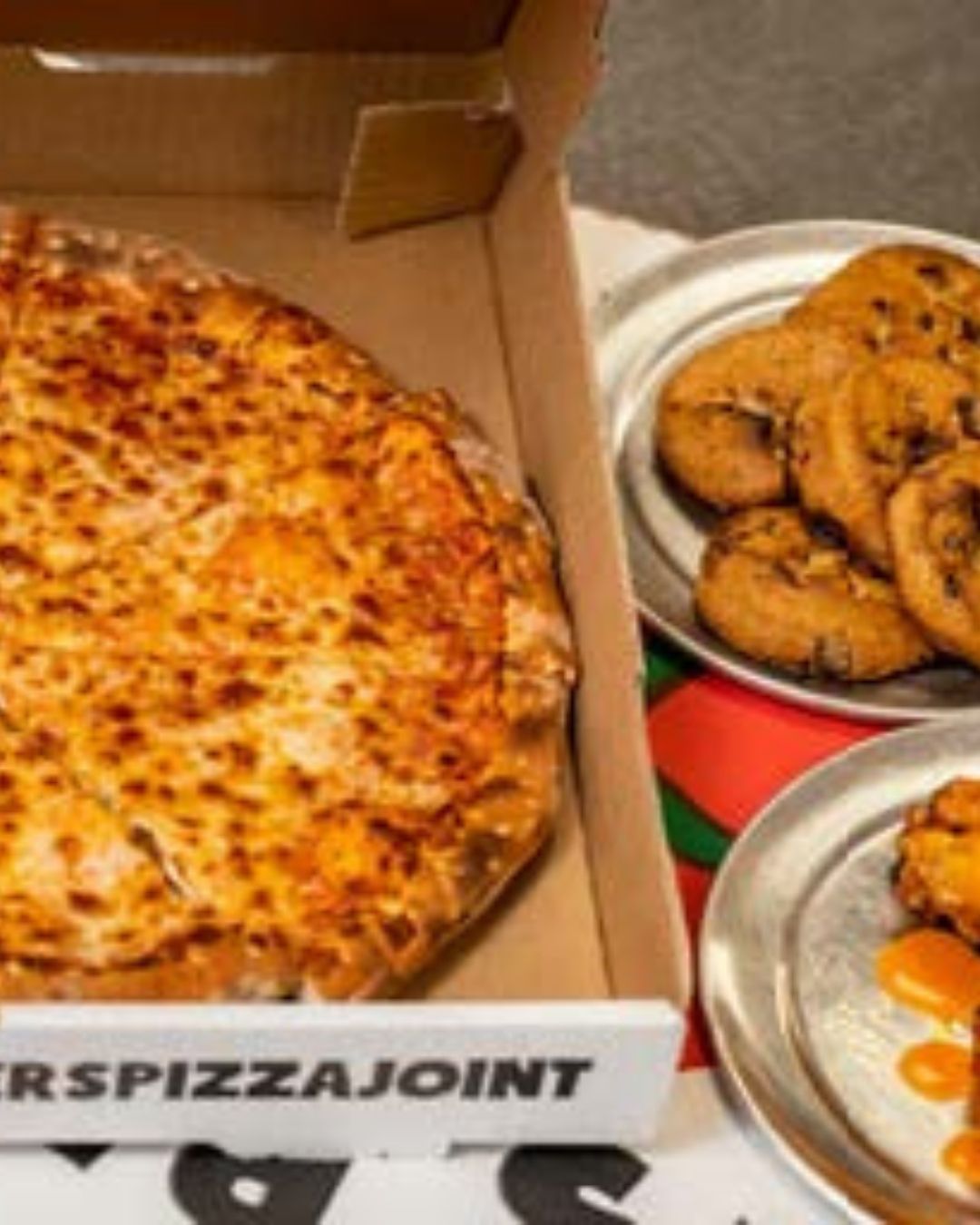 Friends sharing Stoner's Pizza Joint pizza