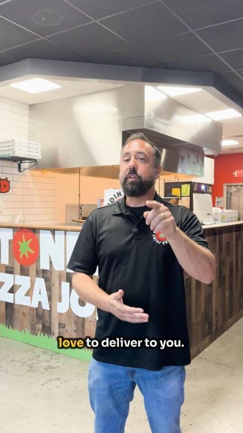 Stoners Pizza Joint owner on camera in a short-form video Live Like Locals produced