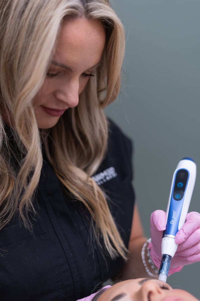 Brand photo by Coastal Moss Creative of a skincare professional performing a microneedling treatment