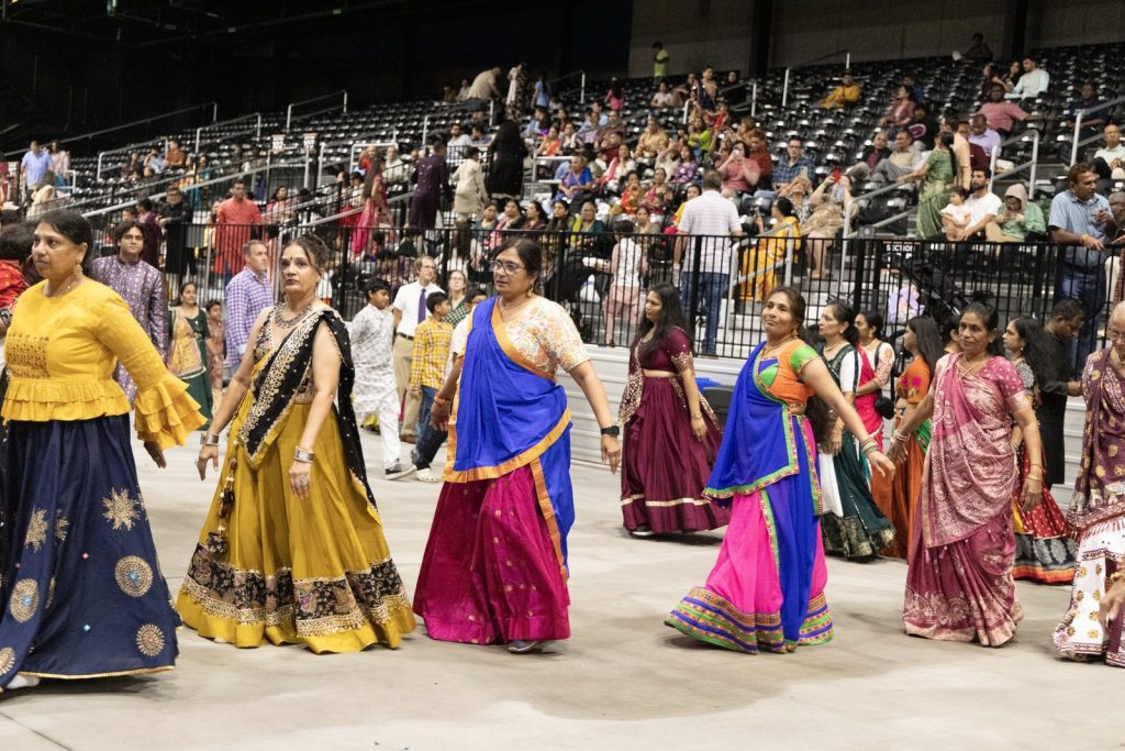 Dancers in colorful chaniya cholis circle the floor at the Garba Festival at VyStar Pavilion in Port Wentworth